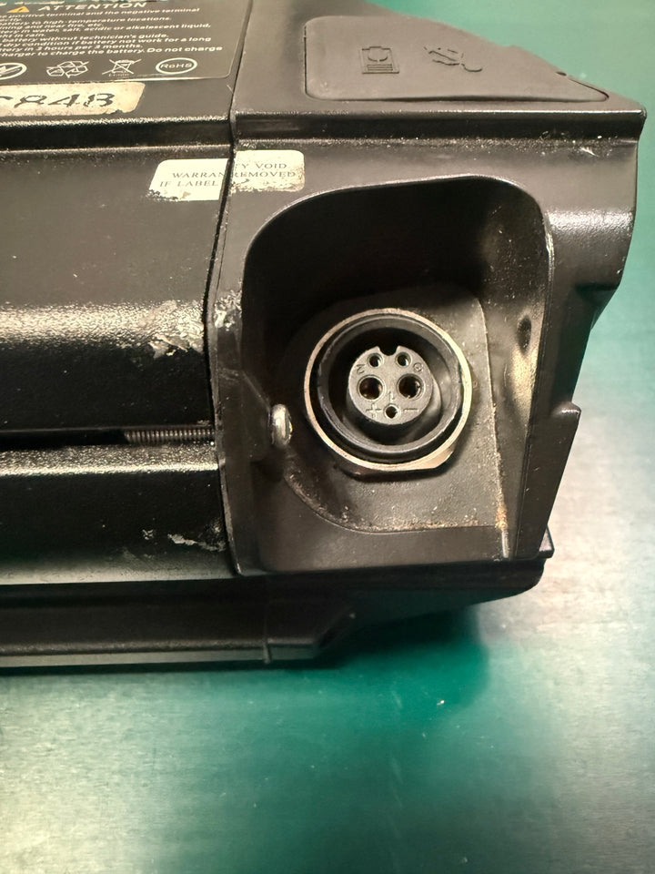Used Reention Dorado MAX eBike battery charging connector close-up
